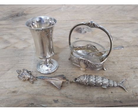 A mixed lot of silver and white metal comprising a German Secessionist style salt with matched spoon, a shot measure, an arti