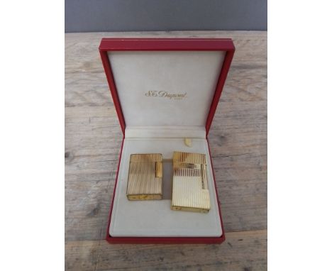 Two vintage Dupont gold plated lighters, one box.  