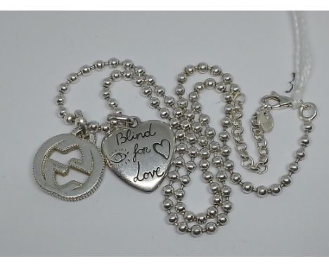 A Gucci boule silver chain with pendants, marked 925, gross wt. 23.4g, length 44cm.  