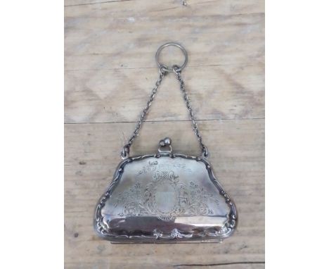 A George V silver purse, leather interior, EJ Houlston, Birmingham 1915, length (including chain) 13cm.  