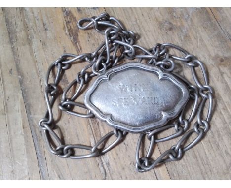 An Elkington &amp; Co silver plated sommelier's label, plaque inscribed 'Wine Steward', date letter 'R' 1928, likely shipping