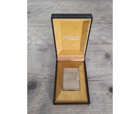 A vintage Dupont gold plated textured lighter with box.  
