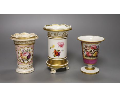 Three English porcelain spill vases, c.1830, the first on three feet painted with seashells, coral and seaweed, the second pa