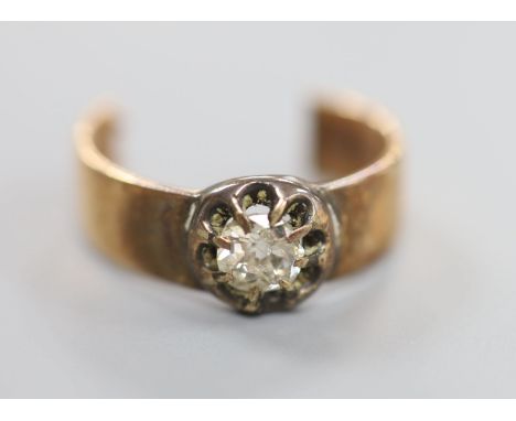 A diamond solitaire and gold ring (tests as 14ct), cut, gross 6.1 grams.
