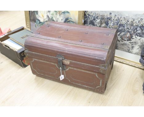 A tin trunk containing a scalloped linen sheet with embroidered monogram linen crochet tablecloths, chemical lace cloth etc.