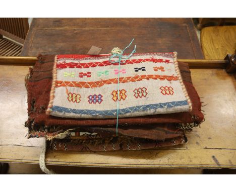 Seven Middle Eastern rugs/saddle bags