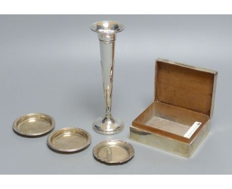 An engine-turned silver cigarette box, a pair of circular pin dishes, another pin dish and a specimen vase