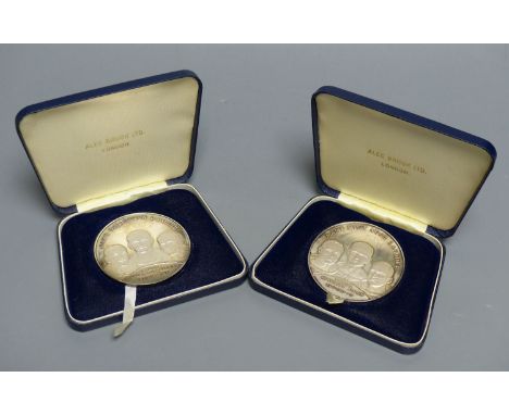 Two sterling silver limited edition 'Man's First Moon Landing' commemorative medals, cased