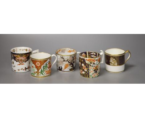 Five English coffee cans, two Derby with different imari patterns, a New Hall can with fruiting trees, Coalport with a kakiem