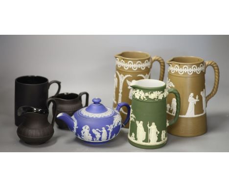 A 19th century Wedgwood teapot and jug, two black basalt jugs and a mug and two drabware jugs, tallest 18cm