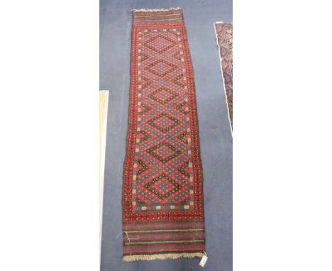 A Kelim polychrome geometric runner, 240 x 59cm