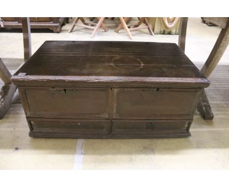 An 18th century oak trunk with dummy drawer front, width 92cm, depth 53cm, height 39cm