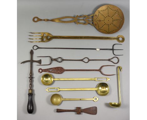 A Brass Fork, 19th Century, with four tines and a cut-out design of three hearts, 23ins, and a collection of cooking implemen