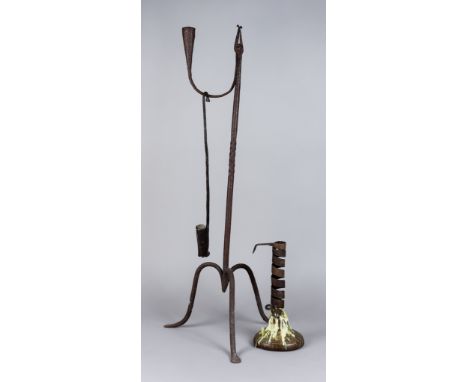 An English Wrought Iron Rushlight Holder with Candle Socket, Late 18th Century, on three shaped legs, 23.5ins high, a wrought