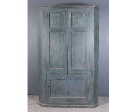 A Late 18th/Early 19th Century Blue Painted Pine Barrel Backed Two Tier Corner Cupboard, with narrow moulded cornice, the cre