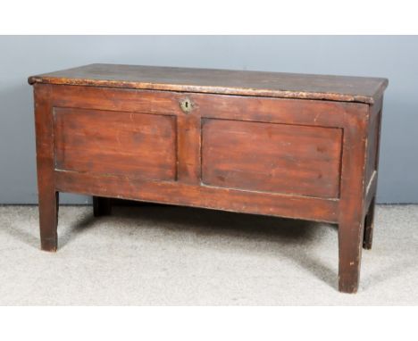 An 18th Century Panelled Stained Pine Coffer with plain lid, twin panel front on heavy square supports, 43ins wide x 17.5ins 