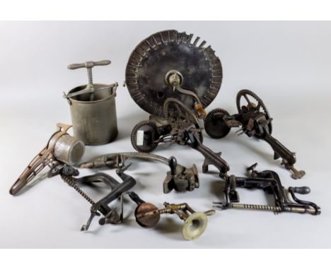 A Collection of Primarily Cast Iron and Steel Kitchen Implements, including - apple peeler with crank handle, 12ins high, rai