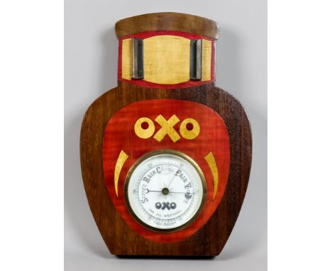 An OXO Advertising Aneroid Barometer, with wood back and aperture for calendar display, 12.25ins high overall