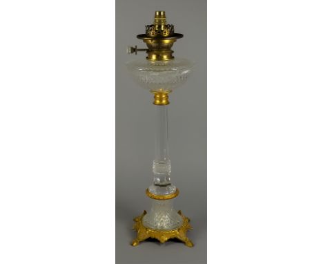 A Continental Gilt Brass and Cut Glass Oil Lamp, Late 19th Century, the reservoir and column diamond and panel cut, on chisel