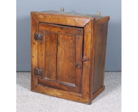 An 18th/19th Century Small Fruit Wood Wall Cabinet, fitted one shelf enclosed by a panel door with heavy iron strap hinges, 1