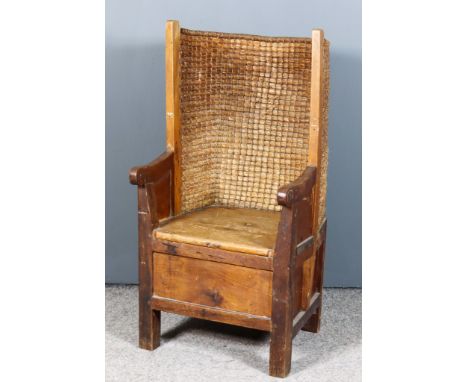 A Late 19th Century Child's Pine Framed Orkney Armchair, with plaited oat straw curved back, wood seat with scroll arm termin