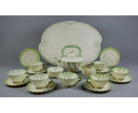 A Belleek "Neptune" Pattern Part Tea Service, Second Period, comprising - tray, 17.5ins x 14ins, teapot and cover with high h