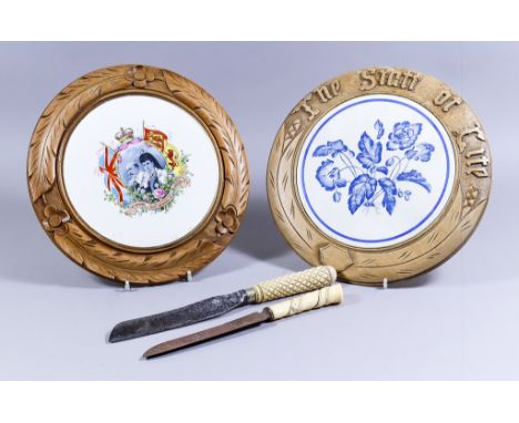 Two Turned and Carved Wood Bread Boards with Ceramic Inserts, Late Victorian, one worded "The Staff of Life", inset with blue