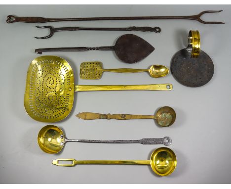 A Brass Skimmer, Late 18th Century, 22.5ins, and a collection of cooking implements, including - a wrought iron two-prong log