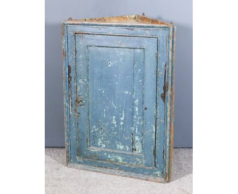 A 19th Century Blue Painted Pine Hanging Corner Cupboard, fitted two shelves enclosed by a single panel door, 25ins wide x 34