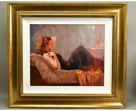 MARK SPAIN (BRITISH CONTEMPORARY), 'Time to Reflect', a full length portrait of a female figure reclining on a chaise lounge,