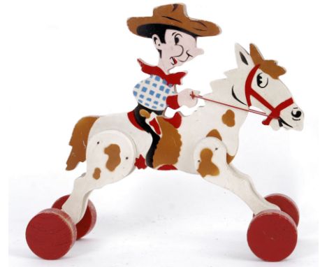 A vintage 1950's / 1960's wooden horse and cowboy on wheels. No brand name visible.&nbsp;

POSTAGE: Worldwide Postage &amp; P