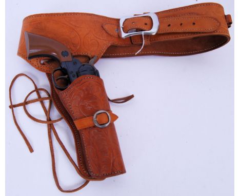 A good vintage Daisy made toy plastic gun. Canadian made, 1963. Along with a fitting vintage Argentinian hand tooled leather 