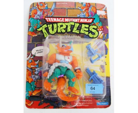 TEENAGE MUTANT NINJA TURTLES: An original vintage 1990's Playmates made Teenage Mutant Ninja Turtles 27 back carded Tricerato