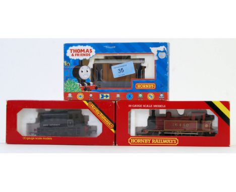 Three Hornby railway models in their original boxes. One model is a dockyard diesel shunter. The second model is a L.M.S Jint