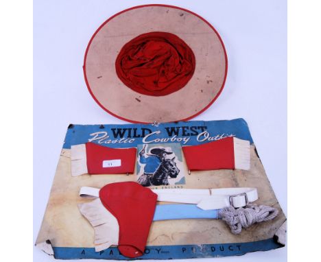 A rare vintage 1950's Palitoy made ' Wild West Plastic Cowboy Outfit '. Unused, the contents still tied to the original card 