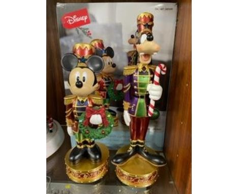 A set of Christmas Disney Mickey Mouse and Goofy nutcracker figures with lights and music, boxed new / old stock, working at 