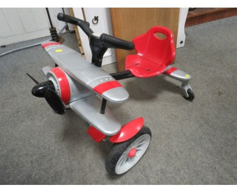 A Rollplay Planedo toy plane aircraft themed childs pedal car