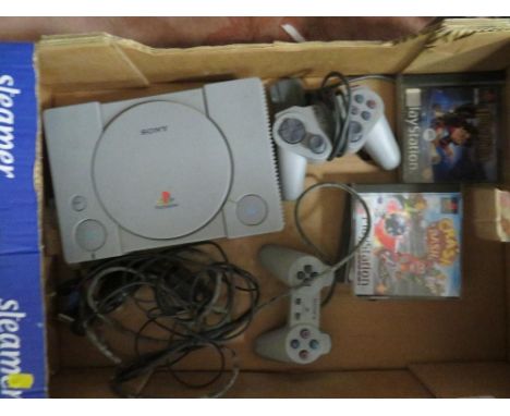 A box containing PlayStation console games, remote etc