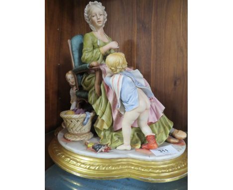 A capodimonte porcelain figure of a Mother darning a sock with children playing around her&nbsp;A/F