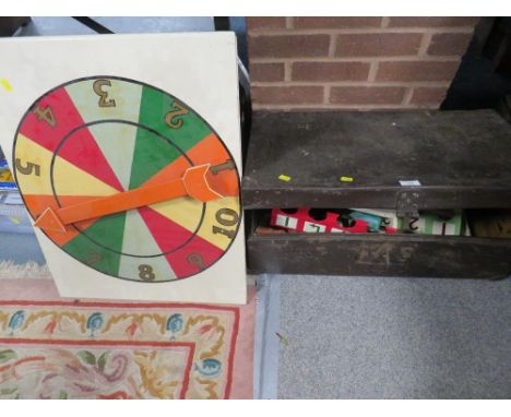 A tin trunk containing a vintage game ??? 