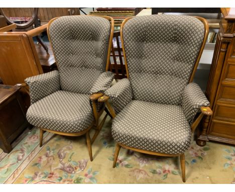 A pair of Ercol upholstered armchairs 
