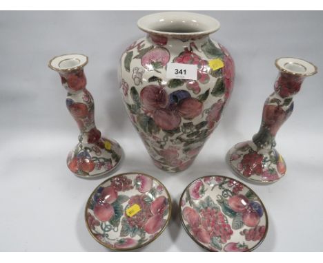 A Toyo ceramic vase, candlesticks and two dishes