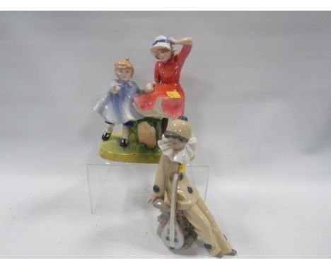 A Royal Doulton figurine 'Milestone' marked as a second A/F together with an Nao figure of a musical clown (2) 