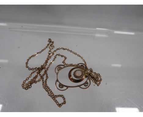 An antique gold pendant set with opal, pendant is marked 9ct