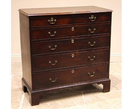 George III mahogany chest of drawers, formed with an arrangement of two short over four graduated, oak lined and cock beaded 