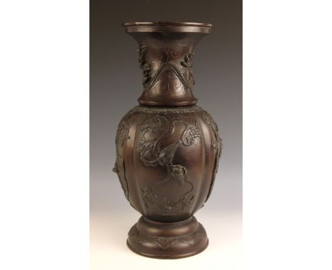 A large Japanese bronze vase, Meiji period (1868-1912), the baluster shaped vase with lobed body and relief decorated with bi