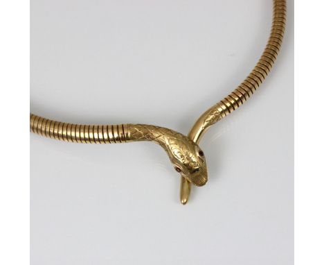 A mid 20th century Smith and Pepper 9ct snake necklace, the engraved head with red stone set eyes leading to pipe shaped neck