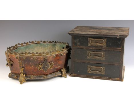 A 19th century French Empire burr walnut and gilt metal mounted planter, of serpentine form, applied with cast roundel and fo