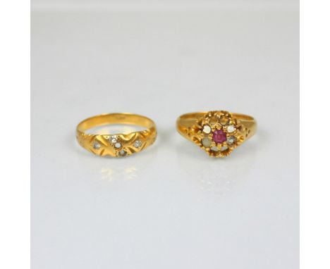 A 19th century 18ct ring, with central ruby, stamped possibly Birmingham 1892, ring size M, with a further 19th century yello