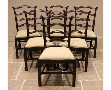 A set of six mahogany Chippendale style ladder back dining chairs, early 20th century, the pierced rail backs over a drop-in 